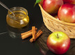 Honey, fresh apples and cinnamon closeup.