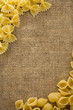 raw pasta on sack hessian background raw pasta on sack hessian background