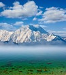 snowbound mountains and emerald sea snowbound mountains and emerald sea