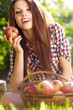 Beautiful woman  in the garden with apples
