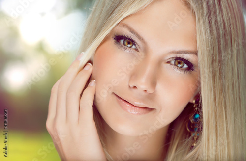 Photo: Portrait of beautiful young woman with blonde hair close-up Portrait of beautiful young woman with blonde hair close-up