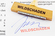 Holzstempel auf Dokument: Wildschäden