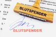 Holzstempel auf Dokument: Blutspender