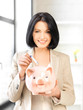 lovely woman with piggy bank and money lovely woman with piggy bank and money