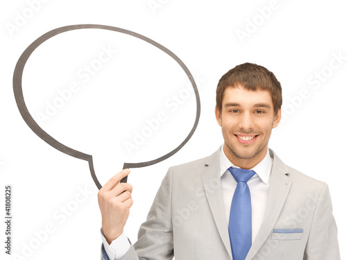 Photo: smiling businessman with blank text bubble smiling businessman with blank text bubble