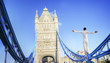Crazy man balancing on the Tower Bridge