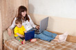Happy woman with toddler using laptops Happy woman with toddler using laptops
