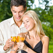 Young happy couple with champagne, outdoor