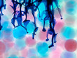 microscopic pink and blue balls in the water blue ink