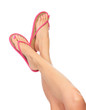 Female legs with flip-flops, isolated on white background. Female legs with flip-flops, isolated on white background.