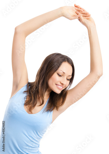 Foto: Young woman exercising, isolated Young woman exercising, isolated
