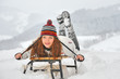 pretty girl  riding on a sled