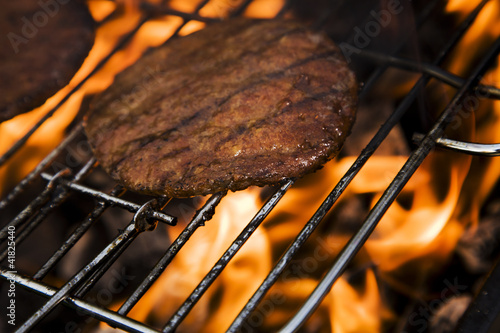 Photo: Burgers on grill in fire! Burgers on grill in fire!