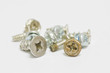 Little screws on white background