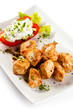 Grilled meat and vegetables on white background Grilled meat and vegetables on white background