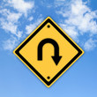 Turn back road sign on beautiful sky background.