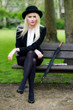 Beautiful young business woman sat on park bench Beautiful young business woman sat on park bench