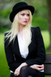 Beautiful young business woman in bowler hat