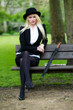 Pretty young business woman relaxing on park beanch Pretty young business woman relaxing on park beanch