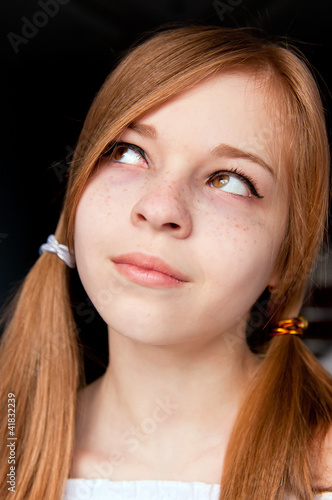 Photo: Cute Girl With Freckles and Pigtails Looking Up Cute Girl With Freckles and Pigtails Looking Up