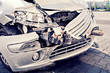 a demolished car after an accident on the street