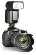 Photo: photo camera with an external flash attached photo camera with an external flash attached