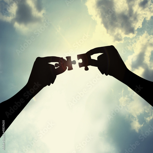 Photo: holding puzzle in sky holding puzzle in sky