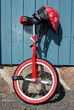 Uni-cycle and red safety helmet with flowers