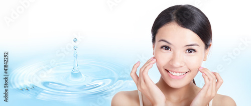 Photo: Skincare woman face with water drop background Skincare woman face with water drop background