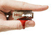 fingers keep the old rusty razor with blood