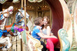 Happy young couple kissing in an equipage of vintage Parisian me