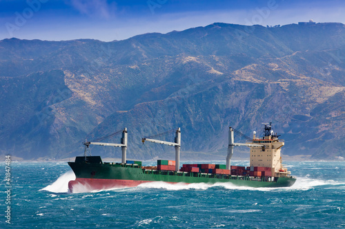 Photo: Loaded container freight ship in stormy sea Loaded container freight ship in stormy sea