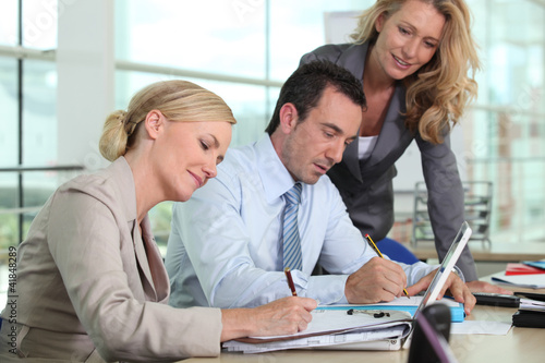 Photo: Three colleagues working together Three colleagues working together