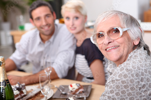 Photo: family having dinner family having dinner
