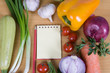 Fresh vegetables and a notebook