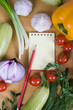 Fresh vegetables and a notebook