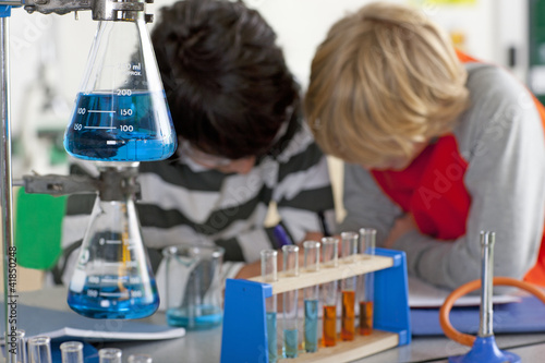 Photo: Students performing experiment in school chemistry laboratory Students performing experiment in school chemistry laboratory