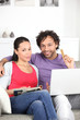 Couple with computer magazine