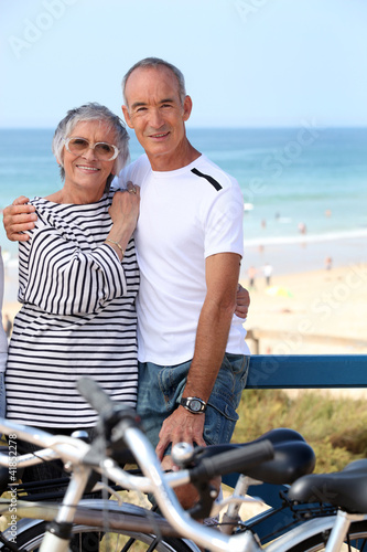 Photo: Mature couple embracing on promenade Mature couple embracing on promenade