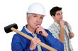 Builder and teenager deep in thought