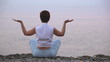 Video: The meditating woman on the sea coast The meditating woman on the sea coast
