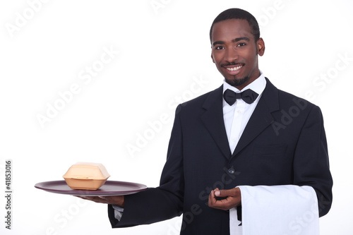 Photo: Butler serving a takeout burger Butler serving a takeout burger