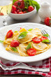 Ravioli with tomatoes and basil
