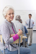 Smiling woman turning in seat during college evening class