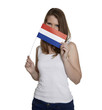 Attractive woman hides her face behind flag of the Netherlands