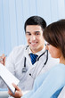 Young doctor and female patient with prescription at office Young doctor and female patient with prescription at office