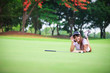 Woman laying on the green grass