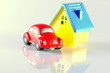 small red toy beetle car and house