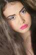 close up studio portrait of young beautiful woman with bright ma