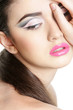 close up portrait of young beautiful woman with bright makeup is